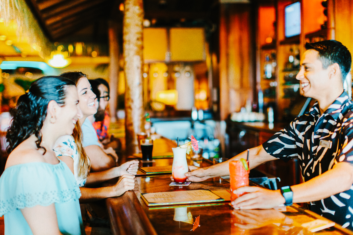 Guests ordering drinks at the bar